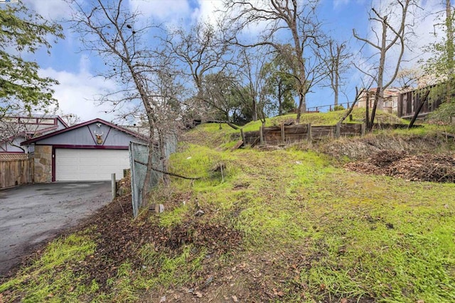 view of yard featuring a garage