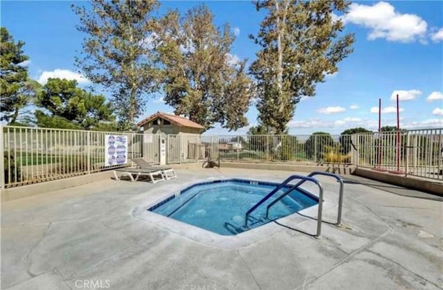 view of swimming pool with a patio