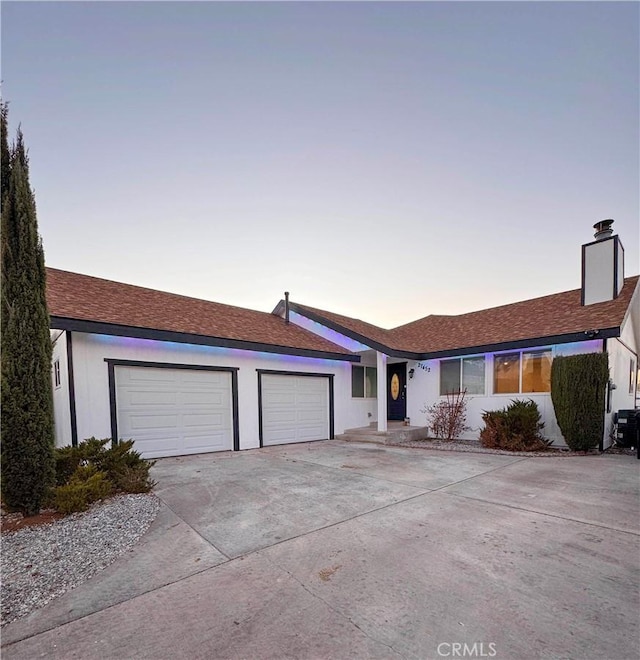 single story home featuring a garage