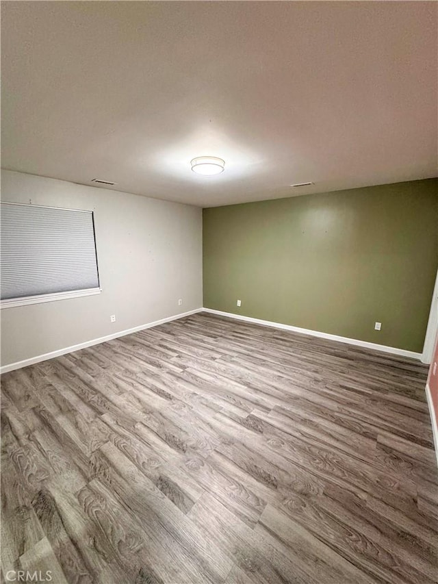 empty room featuring wood-type flooring