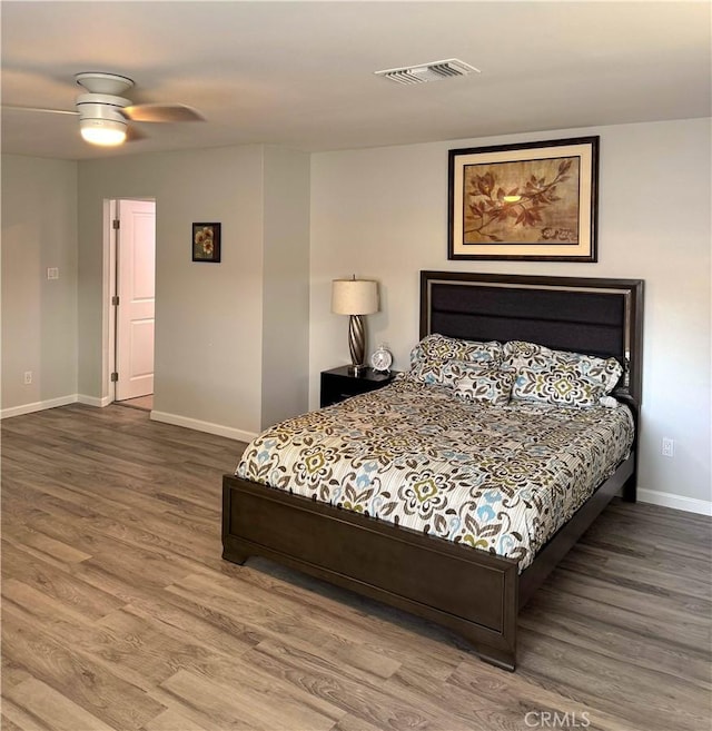 bedroom featuring wood-type flooring and ceiling fan