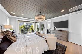 bedroom with access to exterior, wood ceiling, and light hardwood / wood-style flooring