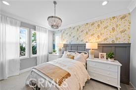 bedroom featuring crown molding and a notable chandelier