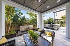 view of patio featuring an outdoor living space and ceiling fan