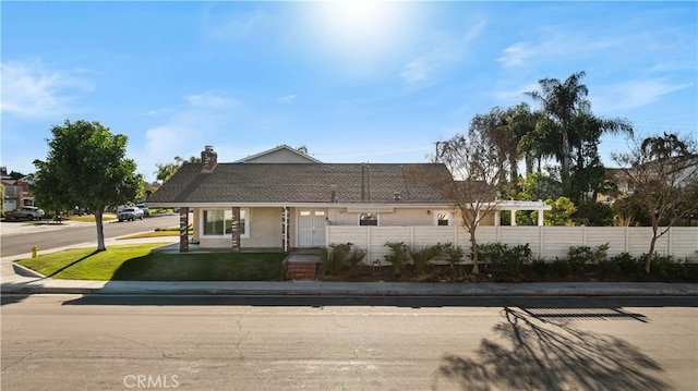 ranch-style house featuring a pergola