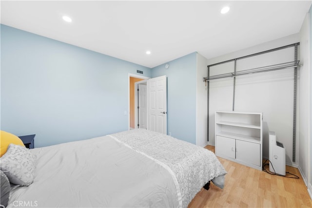 bedroom with light hardwood / wood-style flooring