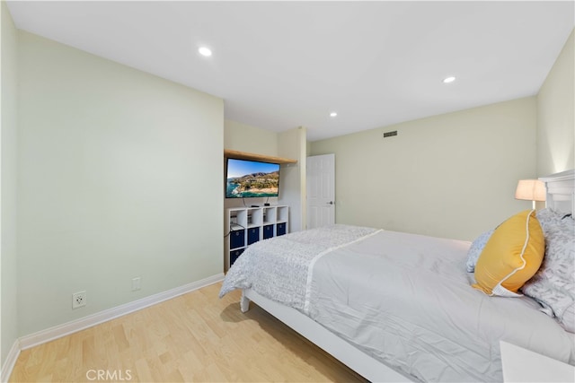 bedroom with light hardwood / wood-style flooring