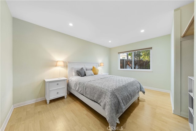 bedroom with light hardwood / wood-style flooring