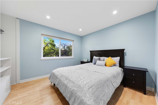 bedroom with light wood-type flooring