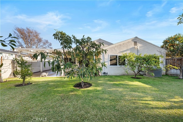 view of yard featuring a pergola and central AC