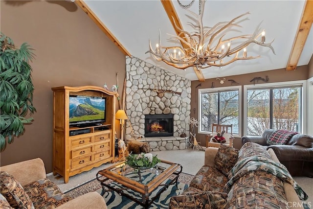 carpeted living room featuring lofted ceiling with beams, a chandelier, and a fireplace