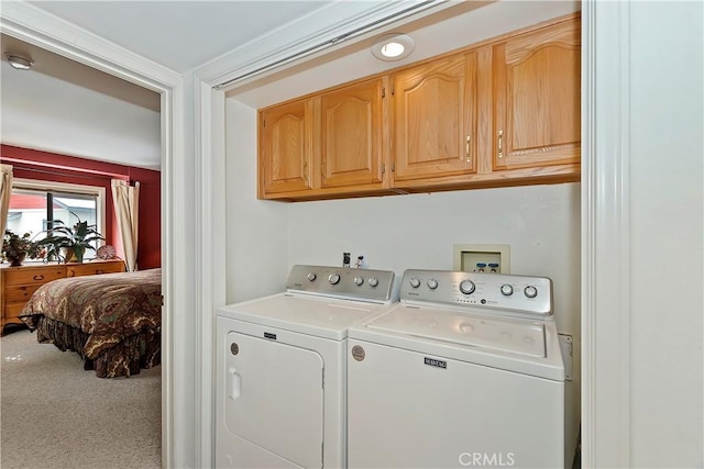 laundry area with cabinets, carpet flooring, and washer and dryer