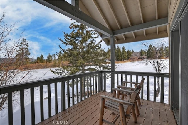 view of snow covered deck