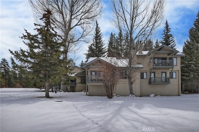 view of front of home with a balcony