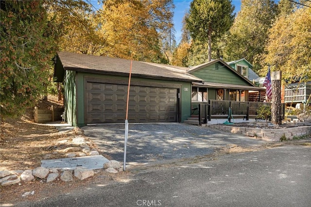 view of front of property with a garage and a porch