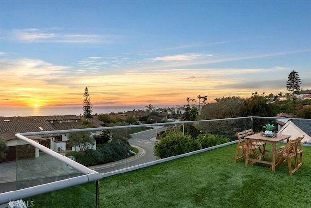 view of balcony at dusk