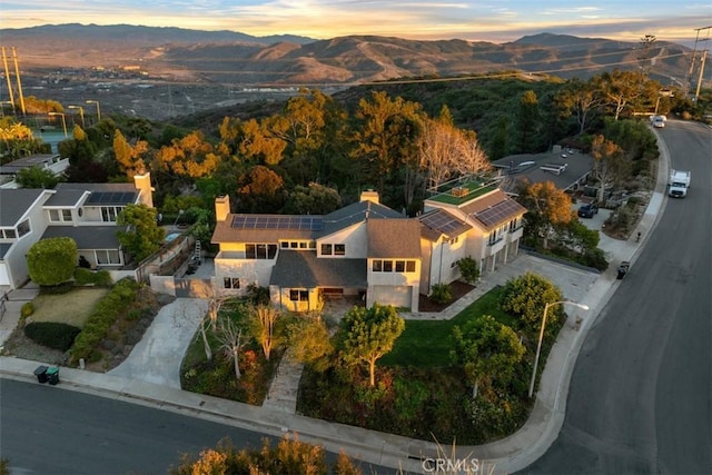 aerial view at dusk with a mountain view