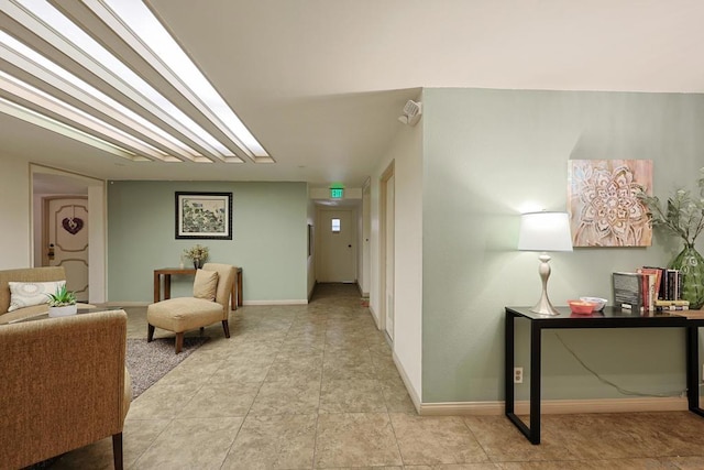 hall with light tile patterned floors