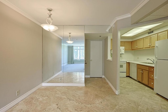 kitchen with crown molding, sink, white appliances, and decorative light fixtures