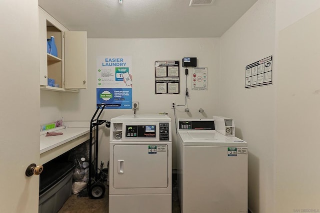 washroom featuring washer and clothes dryer