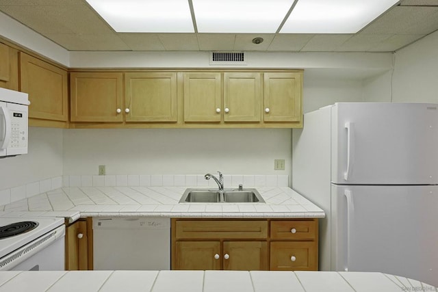 kitchen with sink and white appliances