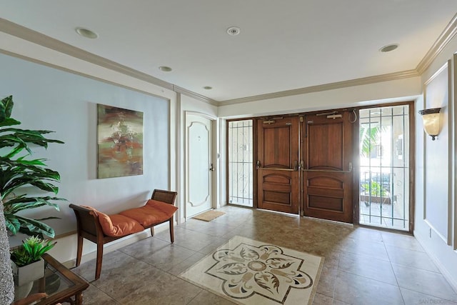 tiled entrance foyer featuring ornamental molding