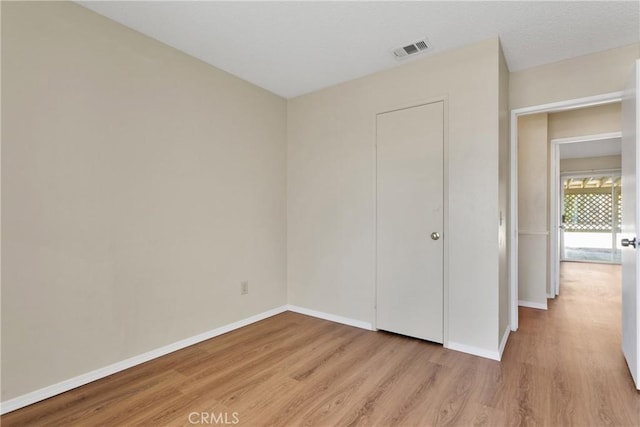 unfurnished bedroom featuring light hardwood / wood-style floors