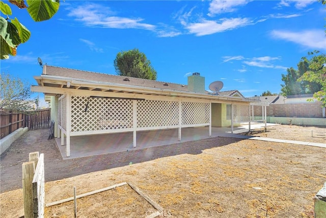 rear view of property with a patio area