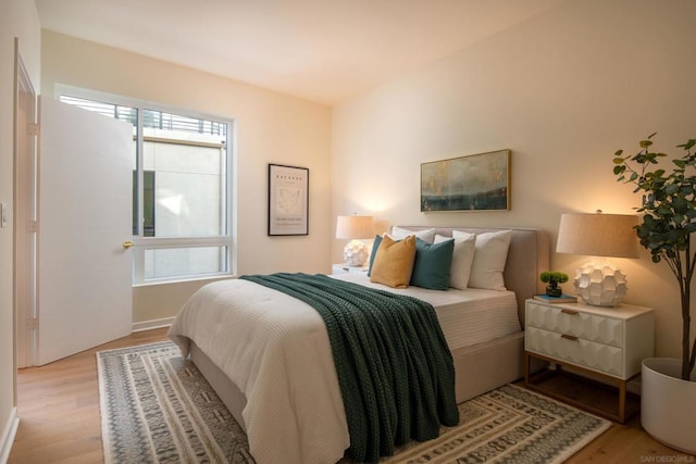 bedroom with light hardwood / wood-style flooring