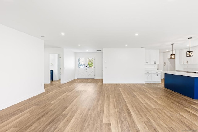 unfurnished living room with light hardwood / wood-style floors