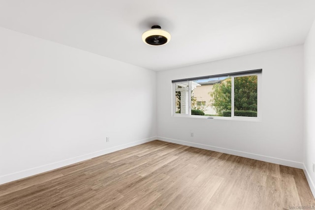 unfurnished room featuring light wood-type flooring