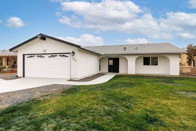 ranch-style home featuring a garage and a front yard