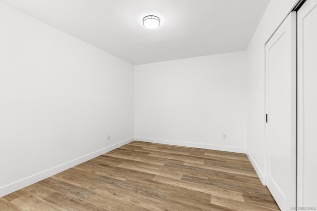 spare room with hardwood / wood-style flooring