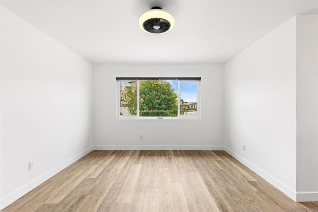 spare room with light hardwood / wood-style flooring