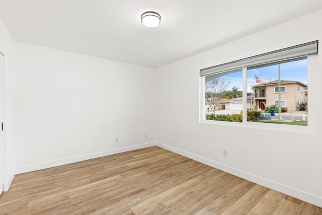 unfurnished room with light hardwood / wood-style flooring