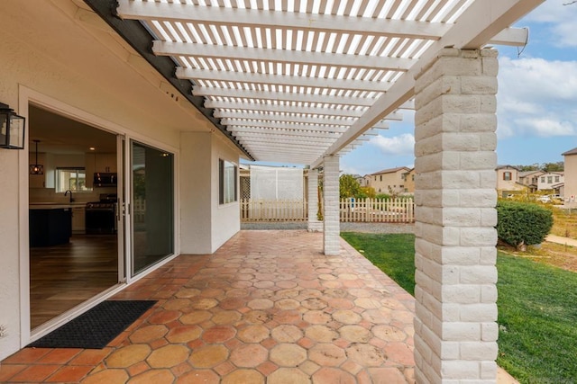 view of patio with sink and a pergola