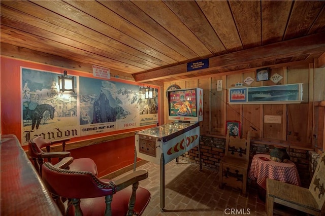 bar featuring pendant lighting, wooden ceiling, and wood walls