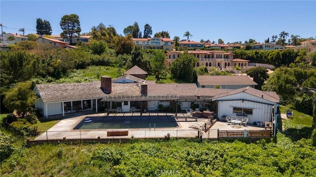 back of property with a patio