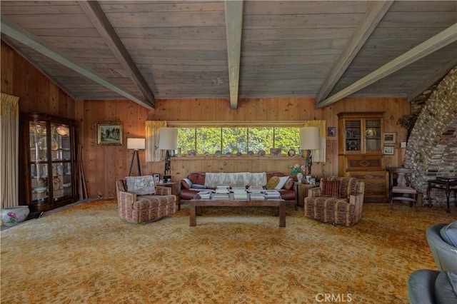 carpeted living room featuring lofted ceiling with beams, wood ceiling, and wood walls