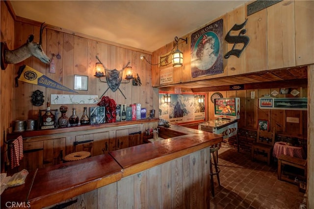 bar featuring wood walls