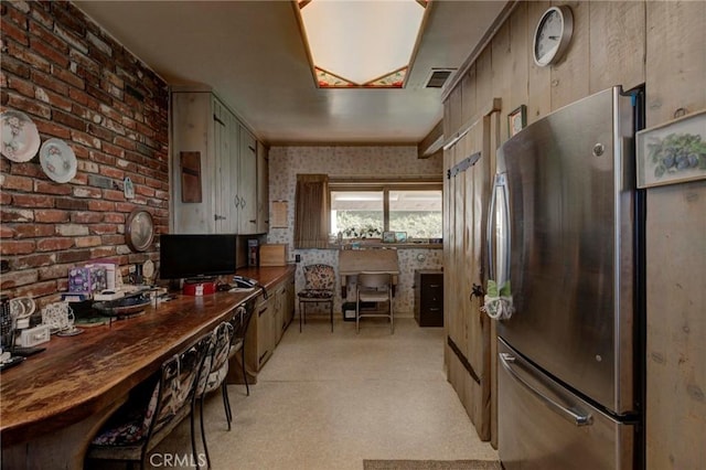 kitchen featuring stainless steel fridge