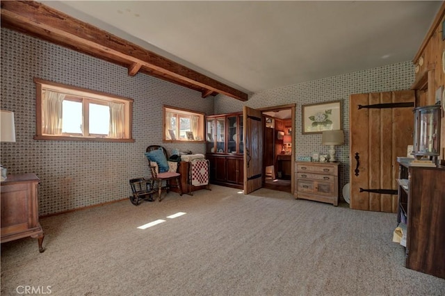 living area featuring light carpet and beam ceiling