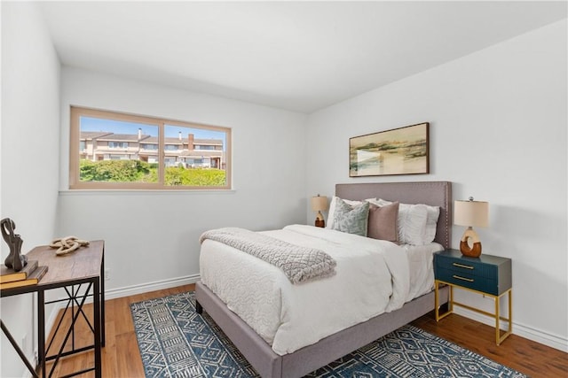 bedroom with hardwood / wood-style floors