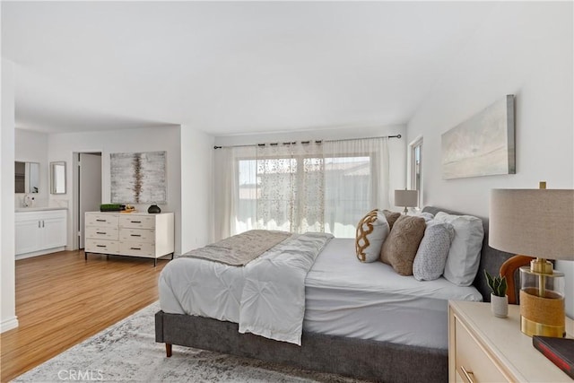 bedroom with light wood-type flooring