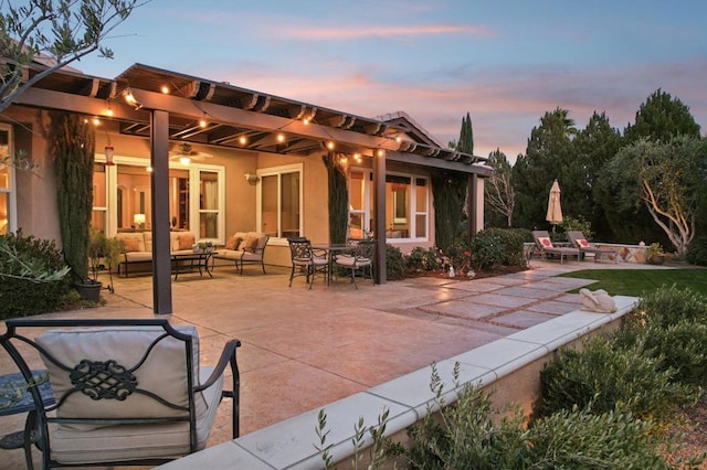 patio terrace at dusk with an outdoor living space