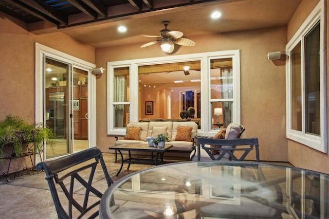 view of patio / terrace with ceiling fan and outdoor lounge area