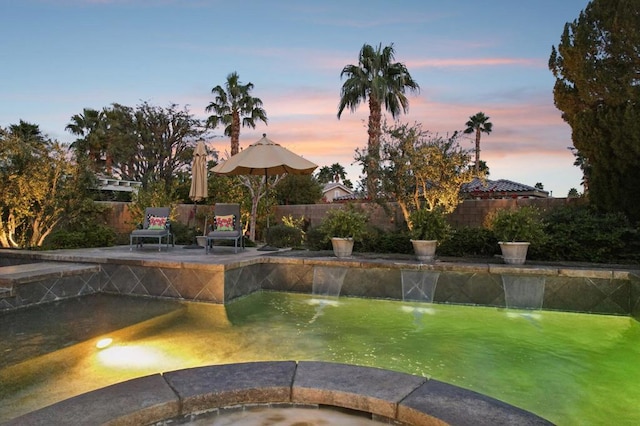 exterior space with a swimming pool with hot tub