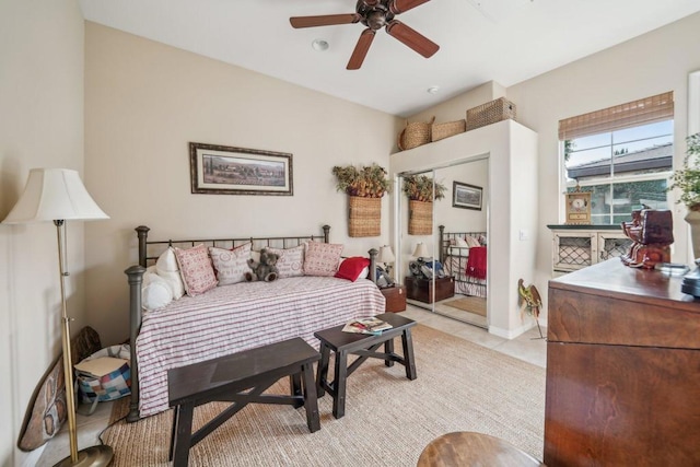 living room featuring light tile patterned flooring and ceiling fan