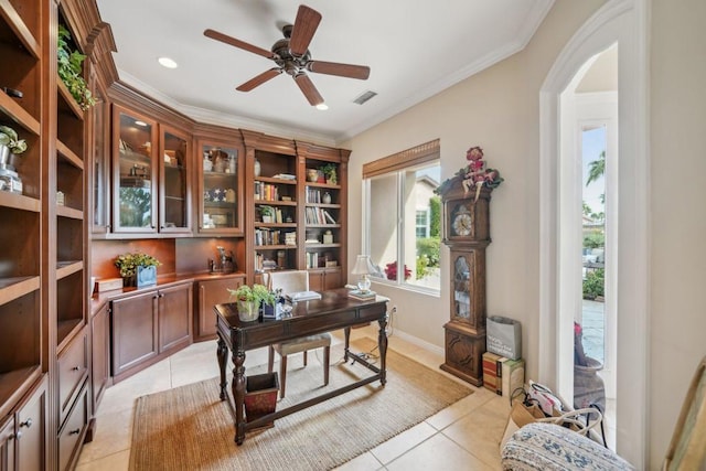 office with crown molding, ceiling fan, and light tile patterned floors