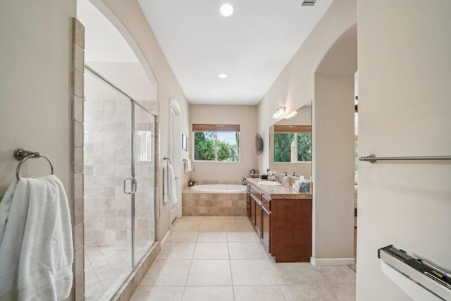 bathroom featuring vanity, separate shower and tub, and tile patterned flooring